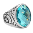 Anillo tramado con piedra facetada celeste de acero quirúrgico